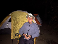 Relaxing at the "campfire" provided by our solar lantern, Luci