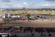 Worries about rain abated in the late afternoon.  This is the view of the track and pits from our table